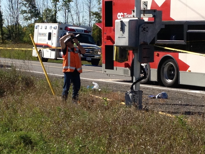 TSB investigators document the accident site where a VIA Rail passenger train collided with an OC Transpo bus at the Fallowfield Station in South Ottawa, Wednesday, Sept. 18, 2013. (TSBCanada / Flicker)