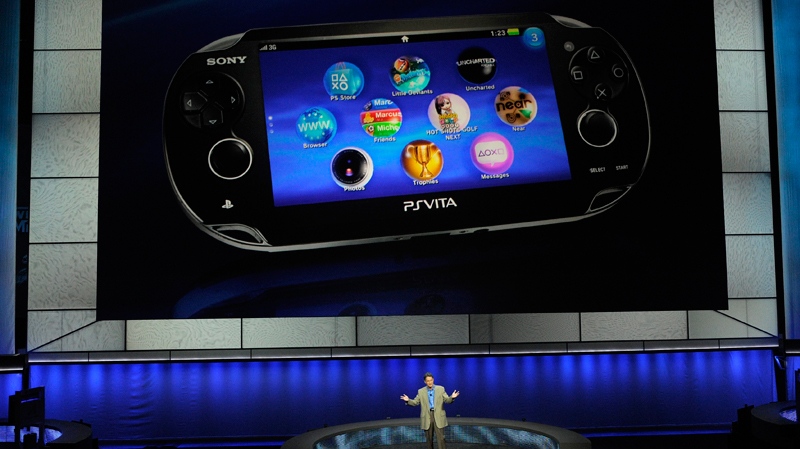 Kazuo Hirai, bottom, president and chief executive of Sony Computer Entertainment America, introduces the company's next generation portable gaming machine, Playstation Vita, during a news conference at the E3 Gaming Convention in Los Angeles, Monday, June 6, 2011. (AP / Chris Pizzello)