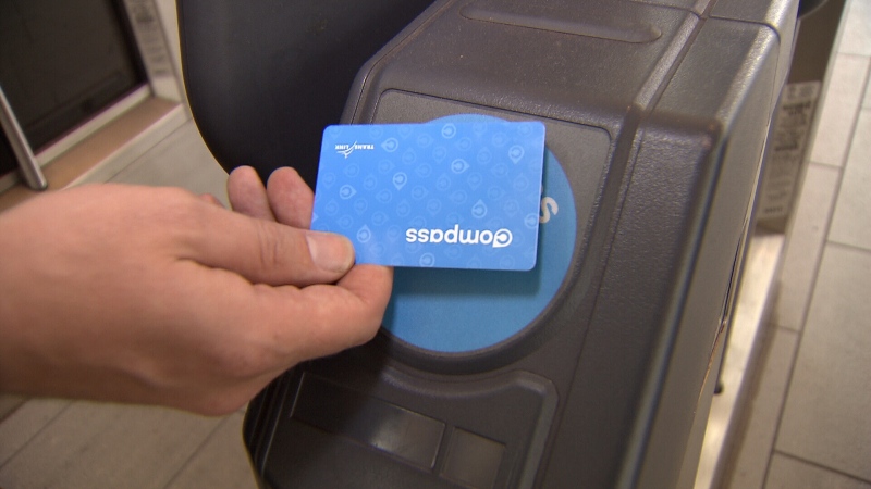 A commuter uses a Compass Card to access a SkyTrain station in this file photo.