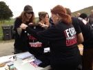 People hand out T-shirts at Ford Fest in Etobicoke on Friday, Sept. 20, 2013. (Cristina Tenaglia/CP24)