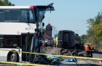 An OC Transpo bus sits where it collided with a Via Rail train during the morning commute in Ottawa, Wednesday, Sept. 18, 2013. (Adrian Wyld / THE CANADIAN PRESS)
