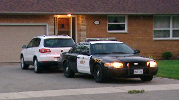 An OPP cruiser sits outside a home on Brock Street East in Tillsonburg, Ont. on Wednesday, June 8, 2011.
