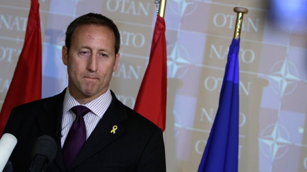Defense minister Peter MacKay listens to questions during a media conference at a meeting of NATO defense ministers at NATO headquarters in Brussels on Thursday, June 9, 2011. (AP / Virginia Mayo)