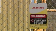 A sign for the Enbridge Line 9 oil pipeline is seen in North Dumfries, Ont., on Wednesday, Sept. 25, 2013.