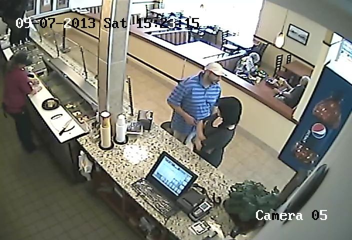 Windsor police released security video of two suspects at Yaya's Flame Broiled Chicken in Windsor, Ont.