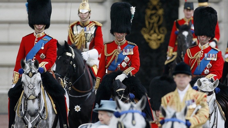 Britain's Prince William, Duke of Cambridge, left, Prince Charles, Prince of Wales, centre, and Duke of Kent, right, ride from Buckingham Palace to the Horse Guards Parade for the Trooping the Colour ceremony to mark the official birthday of the Queen in London, Saturday, June 11, 2011. (AP Photo/Akira Suemori)