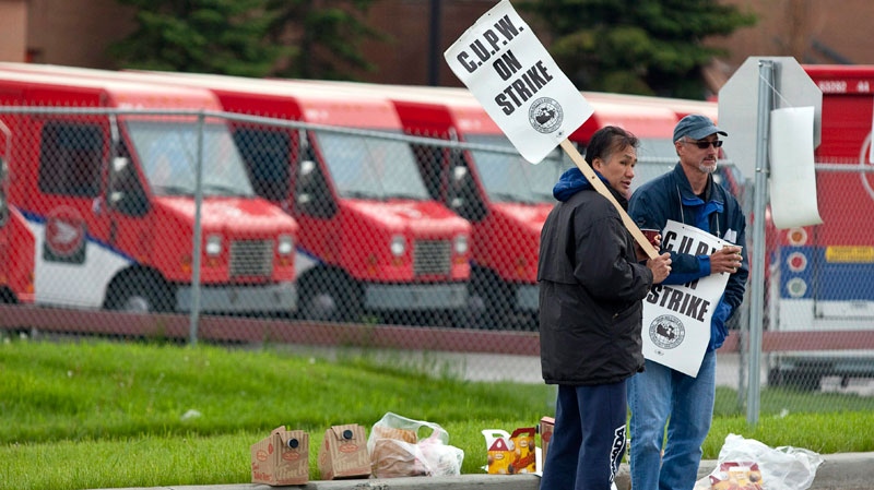 Postal workers are sticking to their strategy of limited rotating strikes for another day, targeting Calgary, Alta., Wednesday, June 8, 2011. (Jeff McIntosh / THE CANADIAN PRESS)