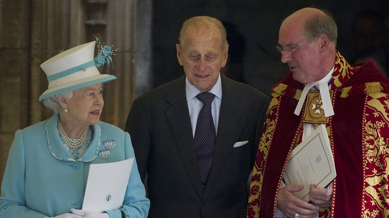 Britain's Queen Elizabeth II and Prince Philip, centre, talk with the Dean of Windsor, Reverend David Conner, as they leave  the Royal Chapel, Windsor Castle on Sunday June 12, 2011. (AP Photo/Carl Court, Pool)
