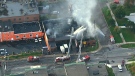 In this aerial view from the CTV News chopper, fire crews work to extinguish the blaze in Etobicoke, Friday, Sept. 27, 2013.