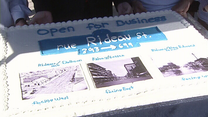 Local merchants held a cake-cutting to celebrate the re-opening of a stretch of Rideau Street