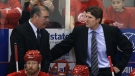 Detroit Red Wings assistant coach Paul MacLean (left) talks with head coach Mike Babcock (right) in a first-round NHL playoff hockey game against the Phoenix Coyotes in Detroit, Sunday, April 25, 2010. (AP Photo/Carlos Osorio)