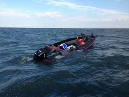 U. S. Coast Guard released this photo of a partially sunken boat on Lake Erie.