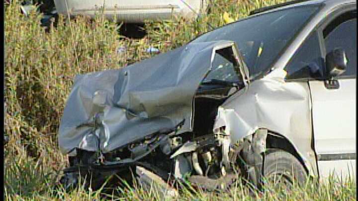 A damaged vehicle is seen following a fatal crash at Calvert Drive and Thames Road in Middlesex County, west of London, Ont. on Tuesday, Oct. 1, 2013.