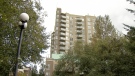 The highrise condo building where six men were gunned down is seen in Surrey, B.C. 