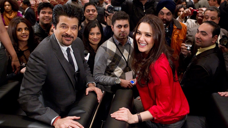 Bollywood film stars Preity Zinta and Anil Kapoor (left) are interviewed by the press in Toronto, on Wednesday, Jan. 19, 2011, following the announcement that the International Indian Film Academy Awards ceremony will be held in Toronto in June 23-25, making it the first time that the awards will be held in North America. (Chris Young / THE CANADIAN PRESS)    