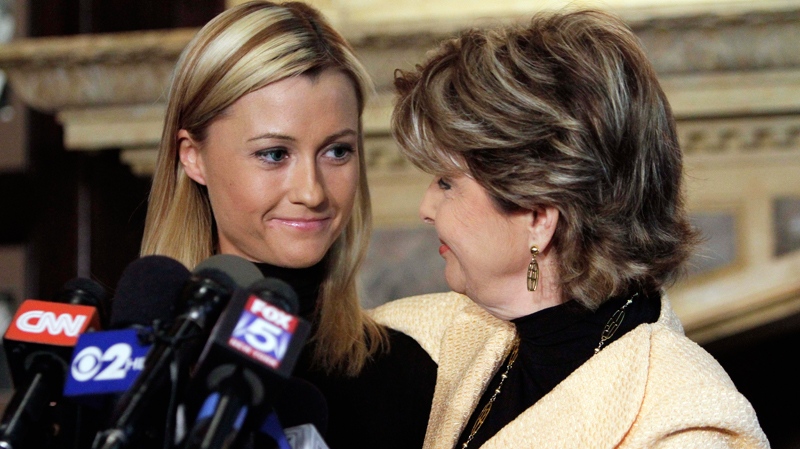 Former porn actress Ginger Lee, left, and her attorney Gloria Allred smile at each other during a news conference at the Friars Club, in New York, Wednesday, June 15, 2011. (AP / Richard Drew)