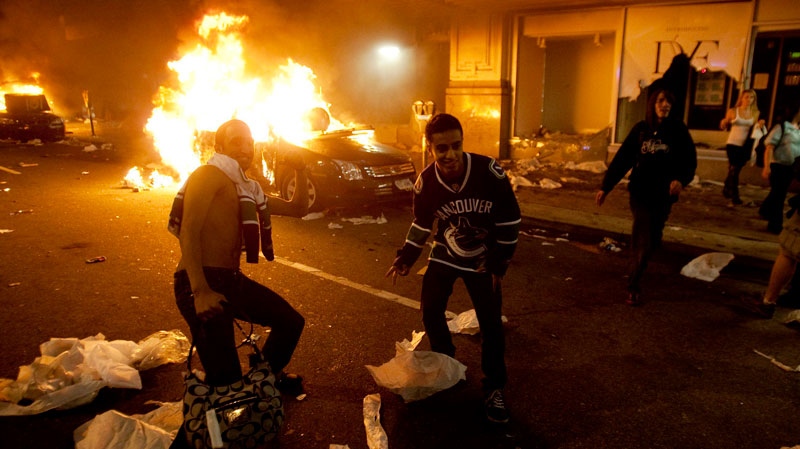 Vancouver Canucks hockey fans take part in a riot in downtown Vancouver following the Vancouver Canucks 4-0 loss to the Boston Bruins in game 7 of the Stanley Cup hockey final on Wednesday, June 15, 2011. (Ryan Remiorz / THE CANADIAN PRESS)