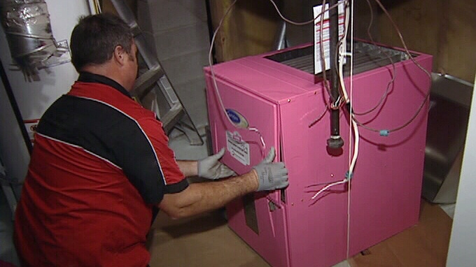 Technicians install new pink furnace