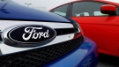 The Ford logo is seen on cars for sale at a Ford dealership in Springfield, Ill. on July 1, 2012. (AP / Seth Perlman)