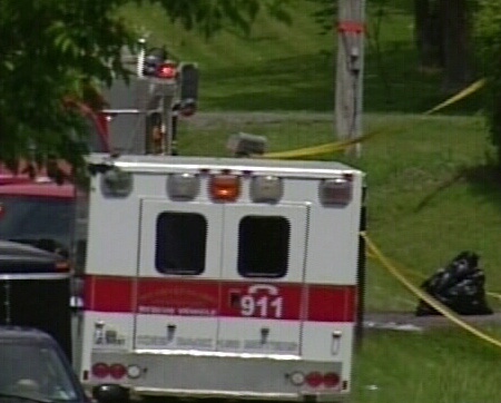 An ambulance was on scene after a standoff injured two officers and one civilian, north of Cornwall, Monday, June 9, 2008.