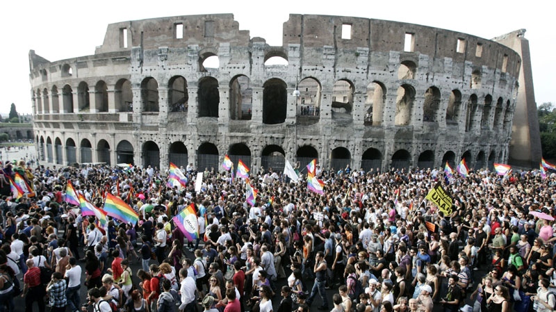 Demonstrators make their way past the Colosseum during the Europride gay rights march in Rome, Saturday, June 11, 2011. (AP Photo/Riccardo De Luca)
