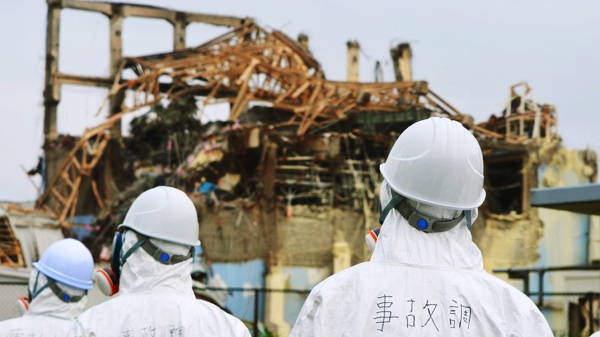 In this photo taken Friday, June 17, 2011, released by Accident Investigation Special Committee via Kyodo News, investigators inspect the Fukushima nuclear power plant's Unit 3 reactor building in Okuma, Fukushima Prefecture, northeastern Japan. (AP /Accident Investigation Special Committee via Kyodo News)