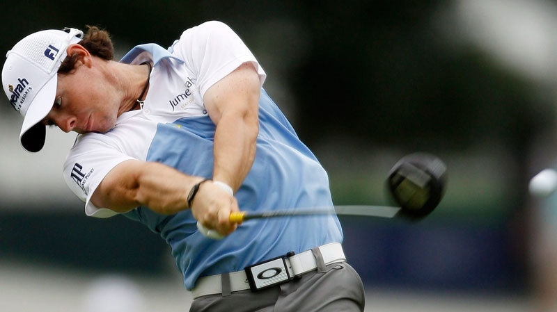 Rory McIlroy, of Northern Ireland, drives from the ninth tee during the third round of the U.S. Open Championship golf tournament in Bethesda, Md., Saturday, June 18, 2011. (AP / Matt Slocum)