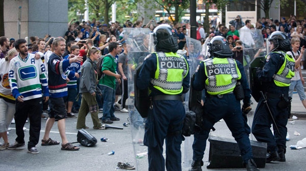 Vancouver Canucks fans riot following game 7 of the NHL Stanley Cup final in downtown Vancouver, B.C., on Wednesday, June 15, 2011. (Geoff Howe /THE CANADIAN PRESS)