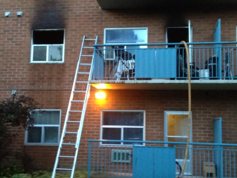 Fire damage can be seen above the windows at an apartment building at 85 Walnut St. in London, Ont., on Thursday, Oct. 10, 2013. (Sean Irvine / CTV London)
