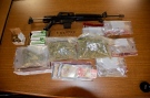 Police seized a rifle and almost $5,000 in marijuana after a search on Huron Street in London, Ont., on Thursday, Oct. 10, 2013. (London Police Service)