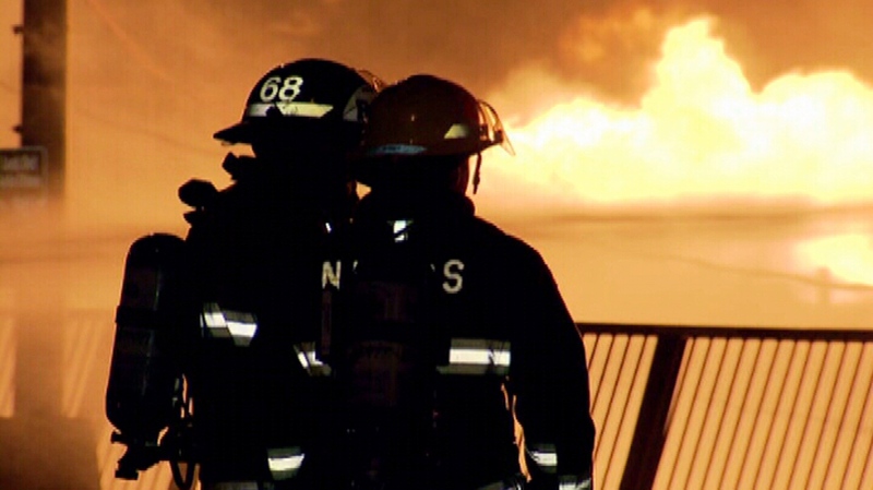 Crews examine a massive blaze in downtown New Westminster Thursday, Oct. 10, 2013. (CTV)
