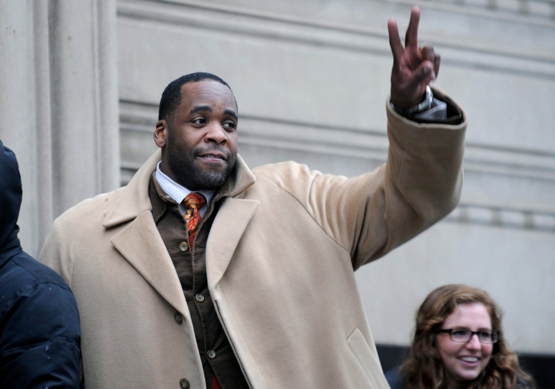 Former Mayor Kwame Kilpatrick waits in line to enter federal court in Detroit during his corruption trial, in this January 2013 file photo. (The Detroit News/David Coates)