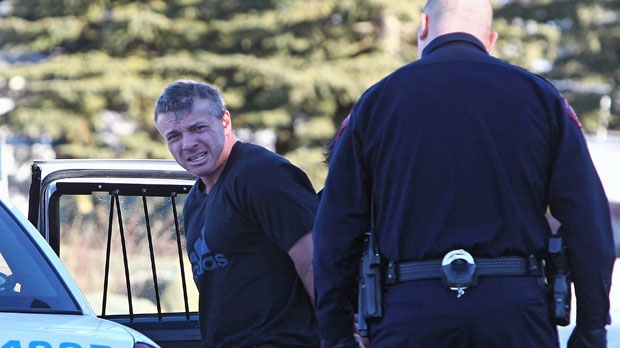 Calgary police take a Steven Molnar into custody for unreleated charges back in 2013. (Courtesy Calgary Sun)