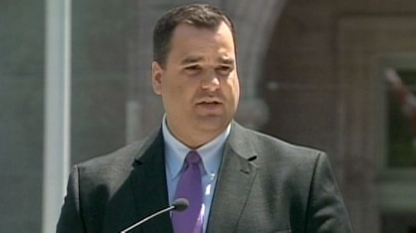 James Moore, the heritage minister, speaks at a press conference in Ottawa, Tuesday, June 21, 2011.