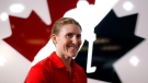 Canadian National Women's hockey player Hayley Wickenheiser, from Shaunavon, Sask., speaks to a reporter a news conference in Calgary, Alta., May 27, 2013. (The Canadian Press/Jeff McIntosh)