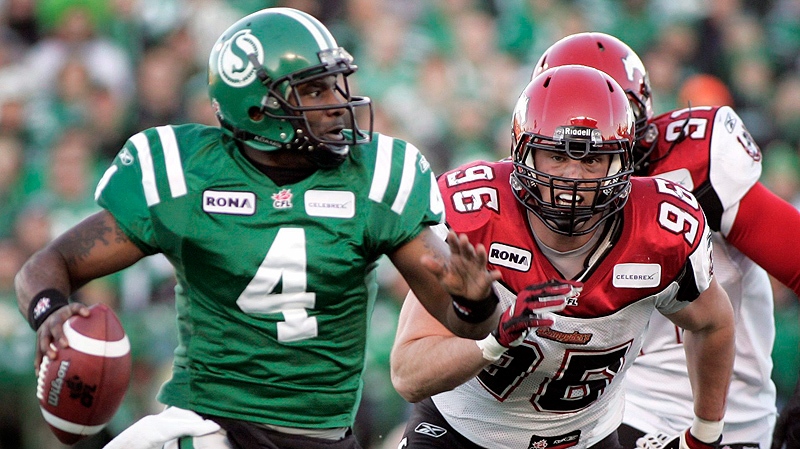 Calgary Stampeders' Miguel Robede, right, chases Saskatchewan Roughriders' quarterback Darian Durant, during first half CFL Western final football action in Regina, Sunday, Nov. 22, 2009. (THE CANADIAN PRESS/Geoff Howe)