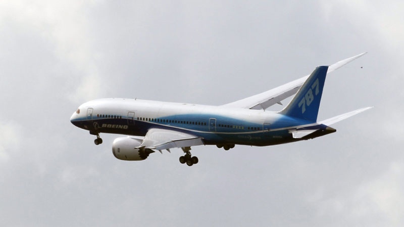 A Boeing 787 Dreamliner prepares to land at Le Bourget airport, during the Dreamliner's first presentation at the 49th Paris Air Show, Le Bourget, east of Paris, Tuesday, June 21, 2011. (AP Photo/Francois Mori)