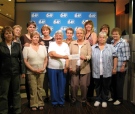 A group of employees in eastern Ontario celebrate their loto winnings in early June 2008.