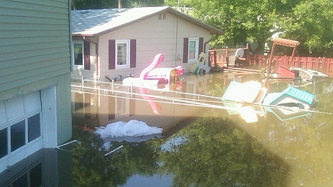 Homes in Minot, N.D. are hit by flood waters on June 23, 2011. 