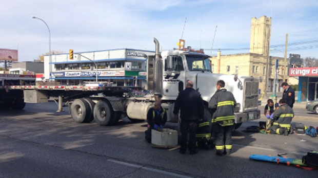 Crews respond to the collision on Portage Avenue near Berry Street in Winnipeg on Oct. 16, 2013.