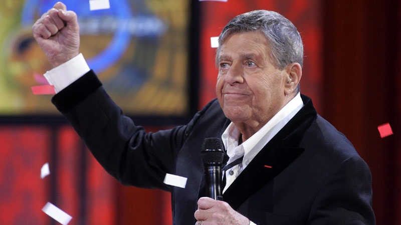 In this Sept. 1, 2008 file photo, Jerry Lewis listens to the final tally of donations during the 43rd annual Muscular Dystrophy Association Labour Day Telethon a the South Point hotel-casino in Las Vegas. (AP Photo/Las Vegas Sun, Steve Marcus, File)