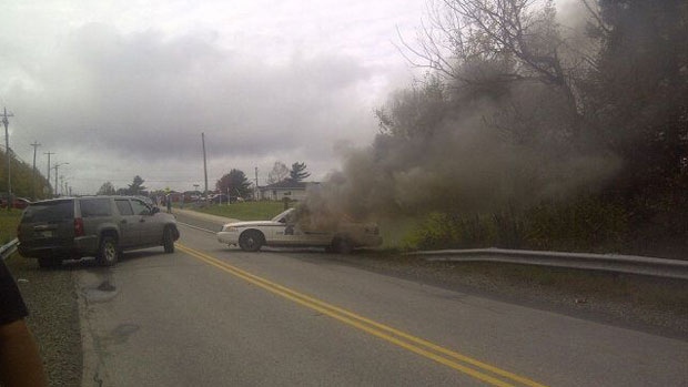 RCMP vehicles on fire shale gas protest