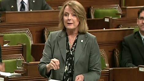 Peggy Nash, MP for Parkdale-High Park, stands and speaks during the debate in the House of Commons in Ottawa, Friday, June 24, 2011.