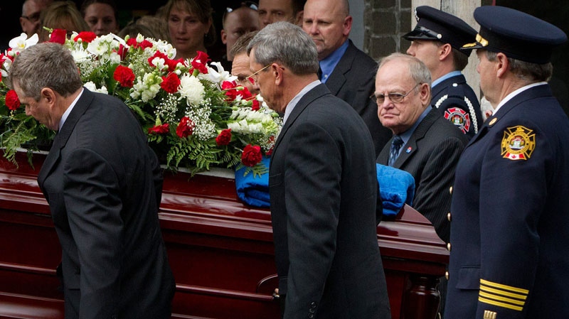 Rolly Fox, second right, watches as pallbearers carry the casket of his wife Betty Fox to a hearse after her funeral in Port Coquitlam, B.C., on Saturday June 25, 2011. (Darryl Dyck / THE CANADIAN PRESS)