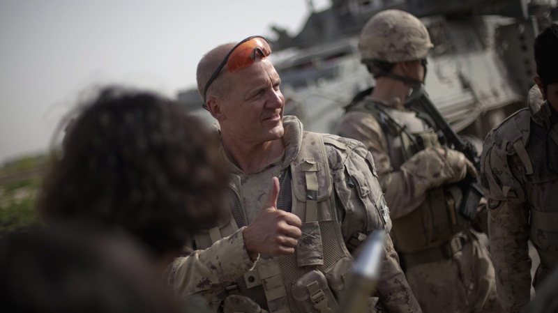Brig.-Gen Dean Milner, Commander of Canadian forces in Afghanistan, leaves a meeting Friday, June 24, 2011 at the local district centre in Zalakhan in the Panjwaii district of Kandahar province, Afghanistan. (AP Photo/David Goldman)