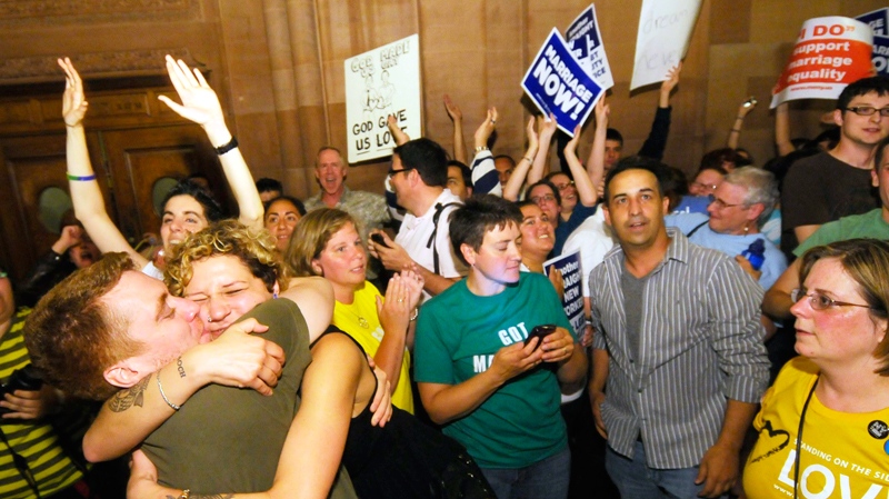 Supporters of same sex marriage celebrate after Senate members voted and approved same-sex marriage at the Capitol in Albany, N.Y., Friday, June 24, 2011. (AP / Hans Pennink)