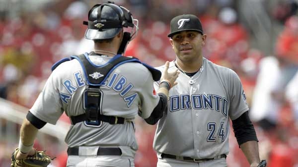Toronto Blue Jays starting pitcher Ricky Romero, right, is congratulated by J.P. Arencibia after throwing a four-hitter in a baseball game against the St. Louis Cardinals on Sunday, June 26, 2011, in St. Louis. The Blue Jays won 5-0 to sweep the three-game series. (THE ASSOCIATED PRESS / Jeff Roberson)