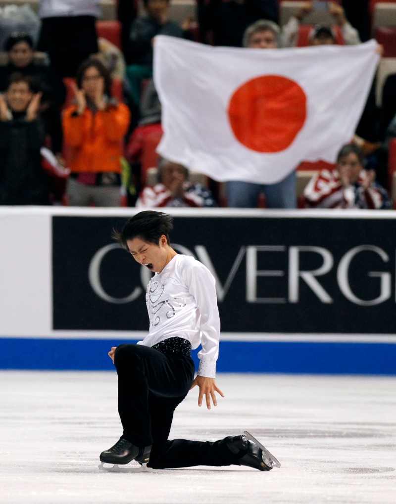 Tatsuki Machida, of Japan, celebrates after performing in the men's short program at the Skate America figure skating competition in Detroit, Friday, Oct. 18, 2013. Machida took first place. (Photo / Duane Burleson)
