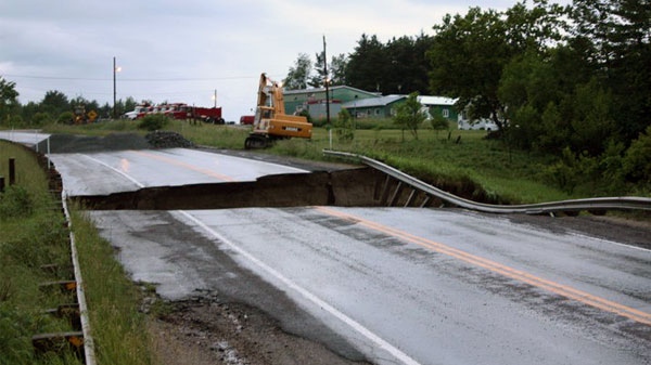 A severe storm washed out parts of Highway 148 near Luskville, Que., creating a giant hole, Friday, June 24, 2011. Viewer photo submitted by: Darlene Morris