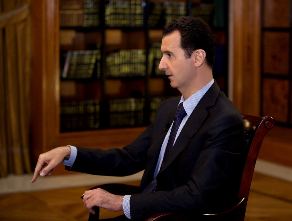 Bashar Assad speaks to reporters in Damascus